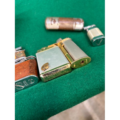 117H - Collection of 13 cigarette lighters including a modernist style Ronson table lighter, a Royal Musica... 