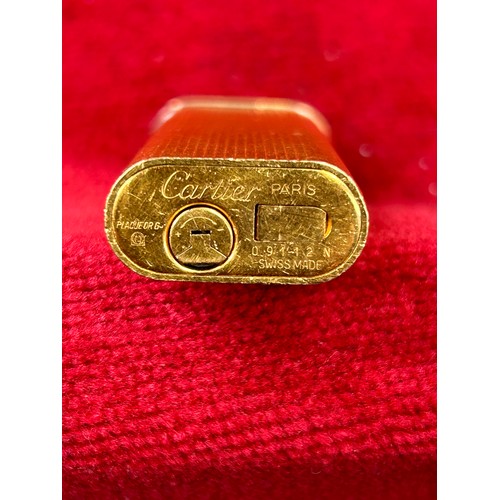 62A - A vintage genuine Cartier gold plated cigarette lighter marked Cartier PARIS PLAQUE OR G 09112N SWIS... 