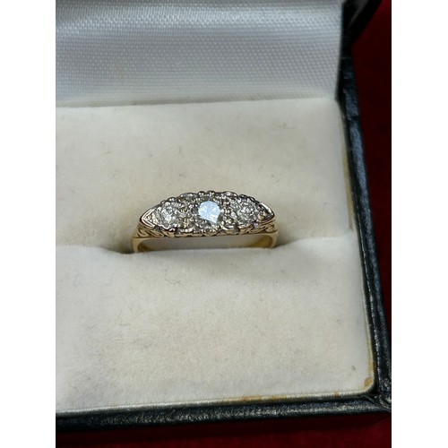 41A - A beautiful 18ct Gold trilogy ring set with a 3mm white round cut diamond flanked by two white round... 