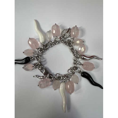 50B - A modernist style designer sterling silver charm bracelet with faceted rose quartz, silver leaf and ... 