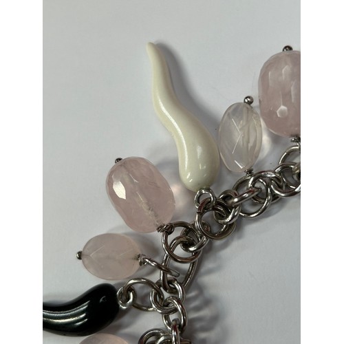 50B - A modernist style designer sterling silver charm bracelet with faceted rose quartz, silver leaf and ... 