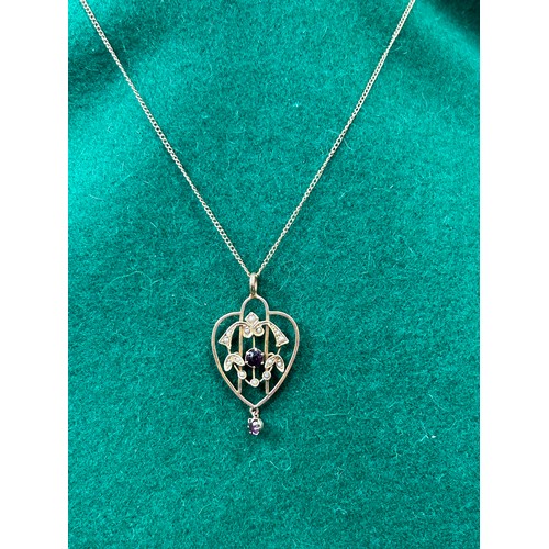 50A - An antique Art Nouveau style pendant with two amethysts and 14 seed pearls on a 9ct gold chain - 3.6... 