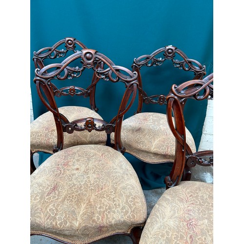 427 - Set of four Victorian dining chairs with ornately carved backs, on cabriole legs. One needs back leg... 