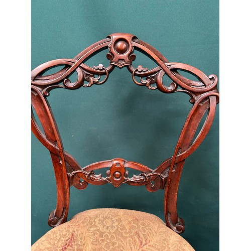 427 - Set of four Victorian dining chairs with ornately carved backs, on cabriole legs. One needs back leg... 