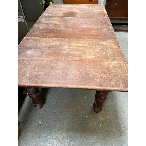 426 - Large Victorian Mahogany Dining table with three loose leaves, on barrel legs. Originally a metamorp... 