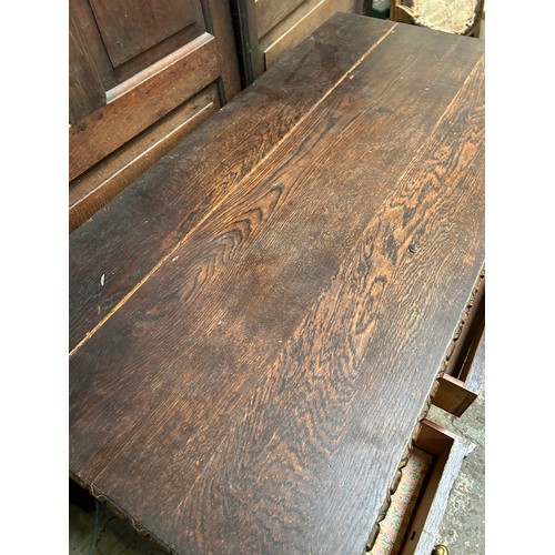 505 - 1920's oak desk with turned legs, 5 drawers and heavy brass drop handles