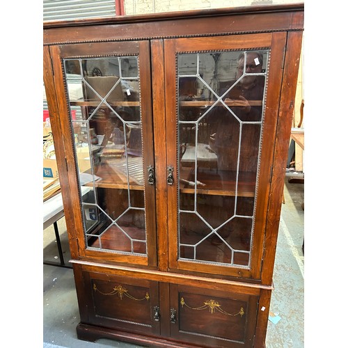 506 - Edwardian Mahogany bookcase cabinet with leaded glass doors - stencilled decoration to bottom doors.