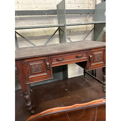 512 - Late Victorian Mahogany desk or side table with 3 drawers, carved panels on original brown pot casto... 