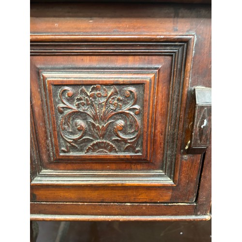 512 - Late Victorian Mahogany desk or side table with 3 drawers, carved panels on original brown pot casto... 