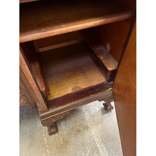 468 - A large 1920's Mahogany Sideboard with two central bow fronted drawers flanked by cupboards on cabri... 