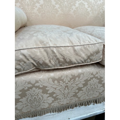 519 - A good quality Knole style two seater sofa - traditionally upholstered in stone coloured damask fabr... 