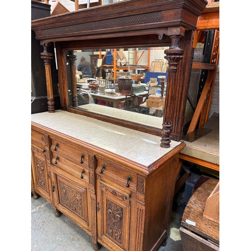 465 - Large Victorian Oak sideboard with mirrored top. The front door panels heavily carved in the Classic... 