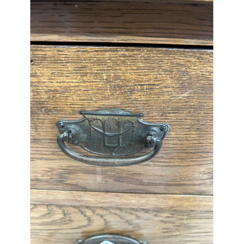 467 - Edwardian Oak chest of three drawers with panelled sides. Original handles in the Art Nouveau style