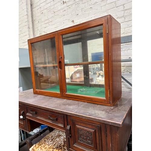 495 - Mid Century teak wall cupboard with glazed doors, baize lined shelves. Marked W & D 1951 and a 