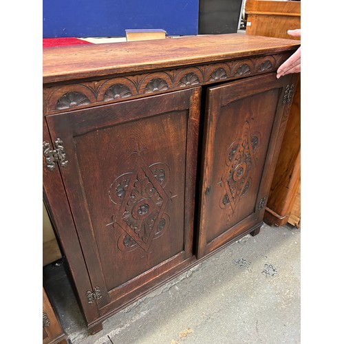 460 - Old Charm style oak cupboard with carved panel doors & internal shelves. W 37” x 14” x 36”