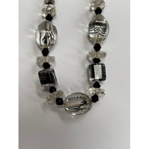 66A - Vintage costume jewellery to include Art Deco faceted clear glass necklace with black threads runnin... 