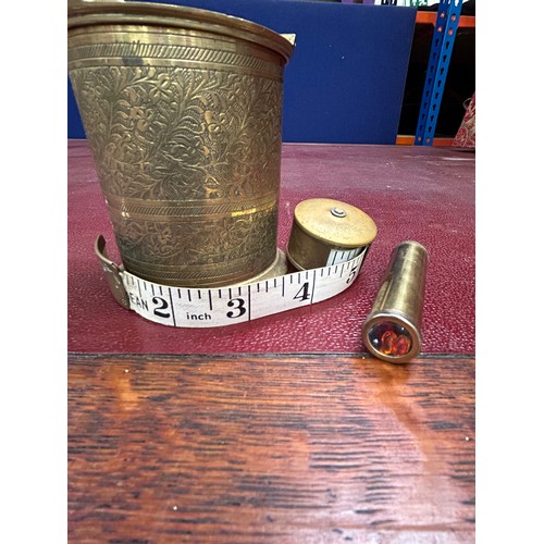 433 - Vintage Indian Brass cigarette dispenser, a brass tape measure by Deans and a miniature brass kaleid... 