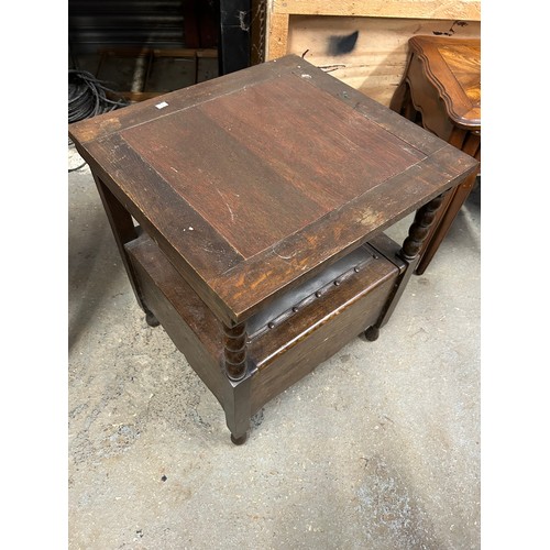 458 - 1920's oak metamorphic commode side table. The chair back lifts and is hinged to form the table top.... 