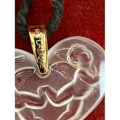 50F - A beautiful Lalique crystal winged cherub pendant with gold bale. Signed to the glass and on the bal... 