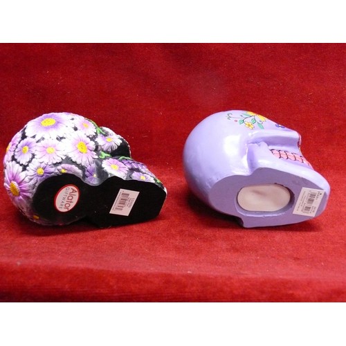 69 - 2 VERY COLOURFUL AND DECORATIVE SKULLS (ONE IS A MONEYBOX)