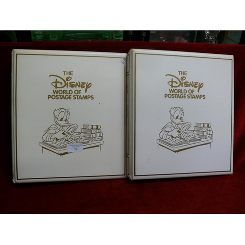 79 - THE DISNEY WORLD OF POSTAGE STAMPS - 2 FOLDERS