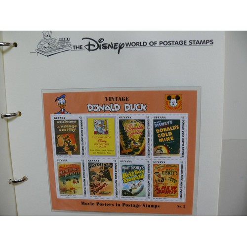 79 - THE DISNEY WORLD OF POSTAGE STAMPS - 2 FOLDERS