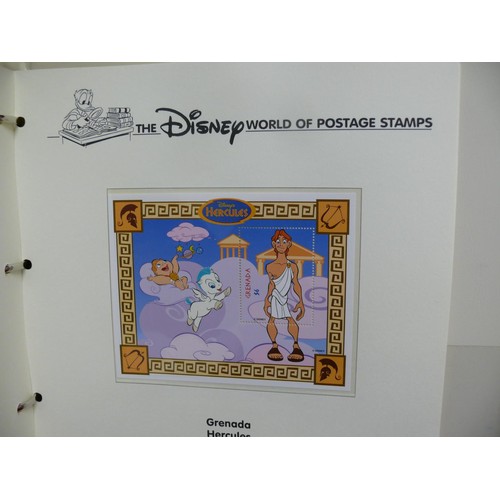 79 - THE DISNEY WORLD OF POSTAGE STAMPS - 2 FOLDERS