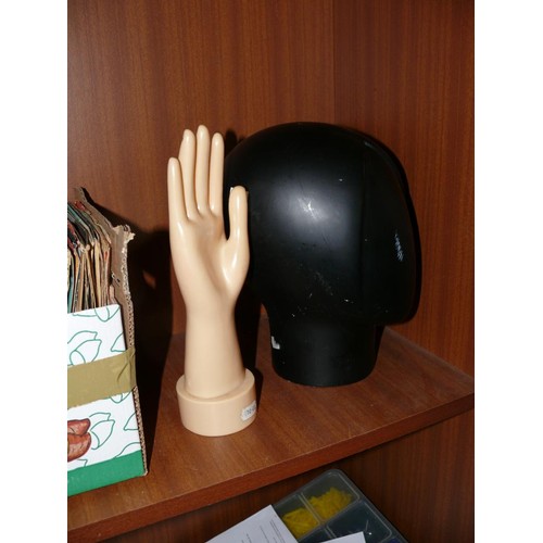 143 - A BLACK MANNEQUIN HEAD HAT STAND PLUS A JEWELLERY STAND IN THE SHAPE OF A HAND