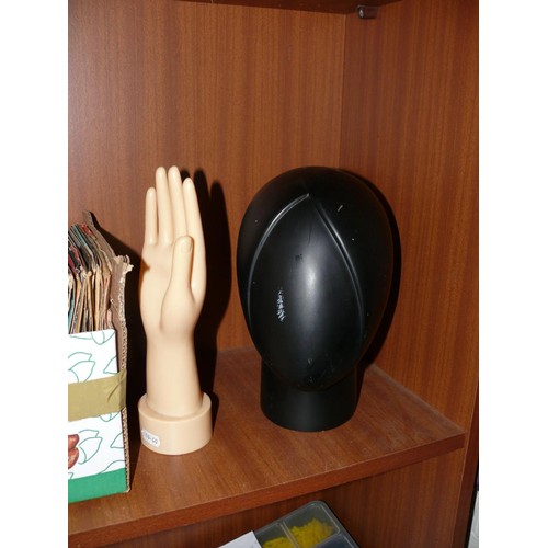 143 - A BLACK MANNEQUIN HEAD HAT STAND PLUS A JEWELLERY STAND IN THE SHAPE OF A HAND