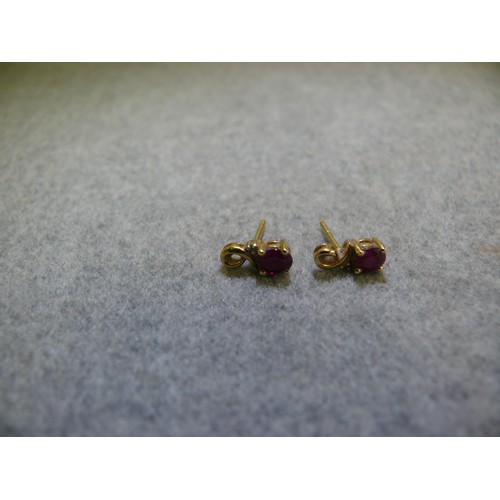 28 - A PAIR OF 9CT GOLD AND RUBY EARRINGS