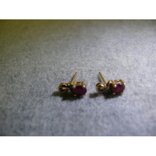 28 - A PAIR OF 9CT GOLD AND RUBY EARRINGS