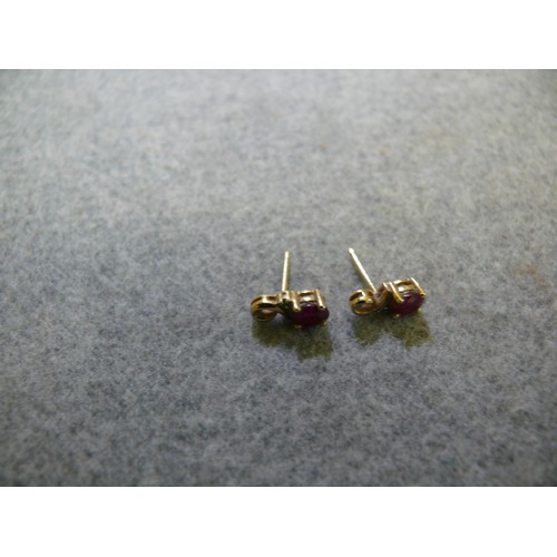 28 - A PAIR OF 9CT GOLD AND RUBY EARRINGS