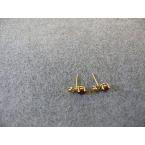 28 - A PAIR OF 9CT GOLD AND RUBY EARRINGS