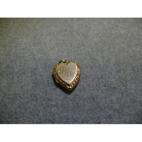 23 - 9CT GOLD HEART SHAPED LOCKET WEIGHS 4 GRMS