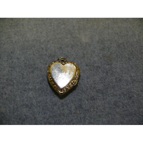 23 - 9CT GOLD HEART SHAPED LOCKET WEIGHS 4 GRMS