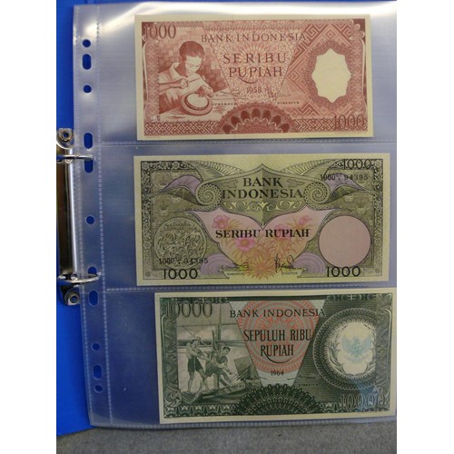 54 - A FOLDER OF 14 INDONESIAN BANK NOTES