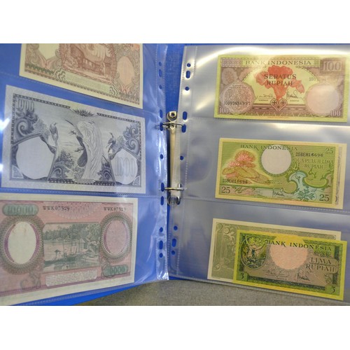 54 - A FOLDER OF 14 INDONESIAN BANK NOTES