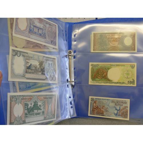 54 - A FOLDER OF 14 INDONESIAN BANK NOTES