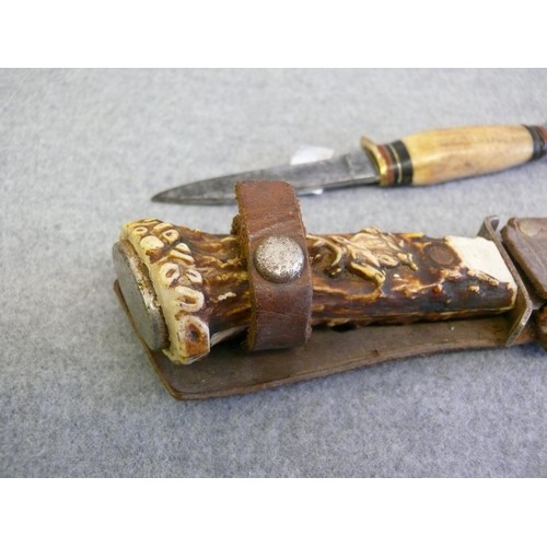 43 - A CARVED HORN HANDLED KNIFE IN LEATHER SHEAF AND A VINTAGE HORN HANDLED BUTLER KNIFE