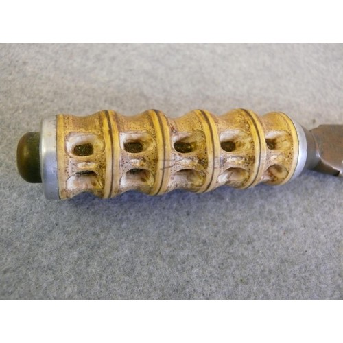 45 - A VINTAGE BRASS AND CARVED BONE HANDLED DAGGER