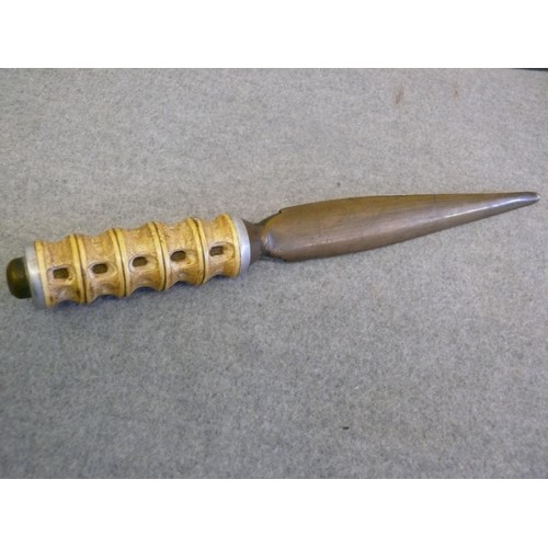 45 - A VINTAGE BRASS AND CARVED BONE HANDLED DAGGER