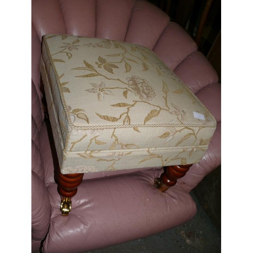 426 - LARGE UPHOLSTERED STOOL ON CASTORS WITH PADDED SEAT AND WOODEN LEGS