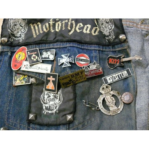 140 - DENIM WAIST COAT ADORNED IN HEAVY METAL BADGES BOTH METAL AND FABRIC