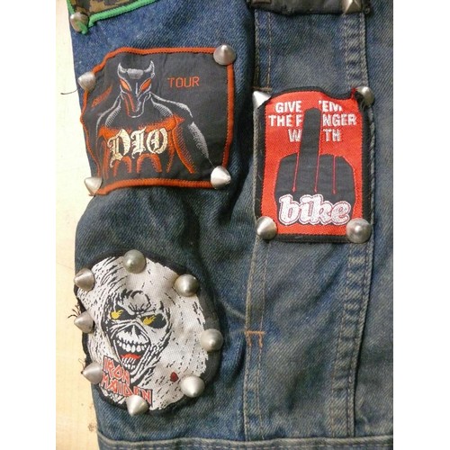 140 - DENIM WAIST COAT ADORNED IN HEAVY METAL BADGES BOTH METAL AND FABRIC