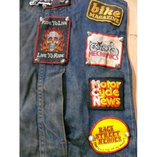 140 - DENIM WAIST COAT ADORNED IN HEAVY METAL BADGES BOTH METAL AND FABRIC