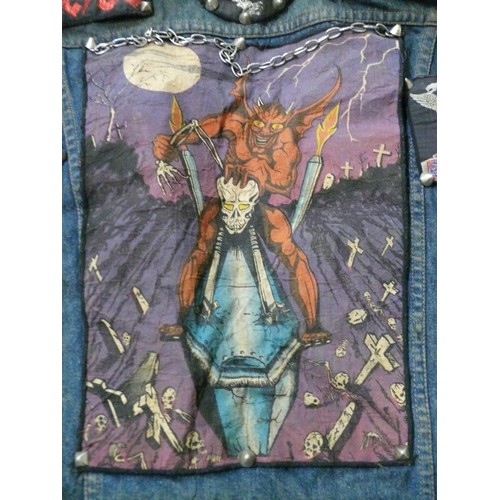 140 - DENIM WAIST COAT ADORNED IN HEAVY METAL BADGES BOTH METAL AND FABRIC