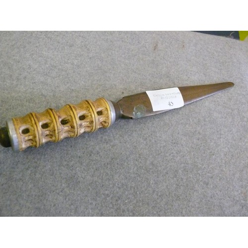 45 - A VINTAGE BRASS AND CARVED BONE HANDLED DAGGER