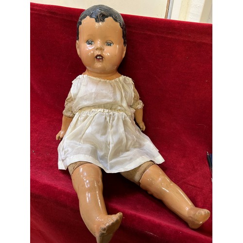 117 - A LARGE CIRCA 1930'S CANADIAN DOLL WITH COMPOSITION HEAD HANDS AND FEET AND A CLOTH BODY