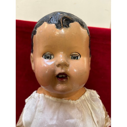 117 - A LARGE CIRCA 1930'S CANADIAN DOLL WITH COMPOSITION HEAD HANDS AND FEET AND A CLOTH BODY