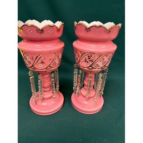 127 - A pair of Victorian pink glass lustres in very good condition. 2 drops missing. One has hairline cra... 